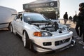 fifth generation white Honda Civic, it is heavily modified for racing