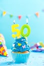 Fiftieth 50th birthday cupcake with candle. Card mockup. Royalty Free Stock Photo