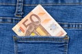 Fifty euro banknote money in pocket jeans pants background texture. 50 euro close up Royalty Free Stock Photo