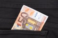 Fifty euro banknote money in pocket jeans pants background texture. 50 euro close up Royalty Free Stock Photo