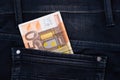 Fifty euro banknote money in pocket jeans pants background texture. 50 euro close up Royalty Free Stock Photo