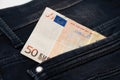 Fifty euro banknote money in pocket jeans pants background texture. 50 euro close up Royalty Free Stock Photo