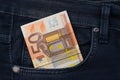 Fifty euro banknote money in pocket jeans pants background texture. 50 euro close up Royalty Free Stock Photo