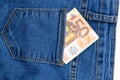 Fifty euro banknote money in pocket jeans pants background texture. 50 euro close up Royalty Free Stock Photo