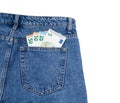 fifty euro bills in the back pocket of denim pants. concept