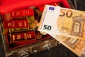 Fifty euro currency note with gold bars and treasure box Royalty Free Stock Photo