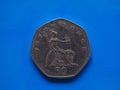 Fifty Pence coin, United Kingdom over blue
