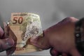 fifty reais bill, 50 reais, brl brazilian money, black background and copy space