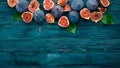Fig. Fresh fruit figs on a blue wooden table. Free space for text. Royalty Free Stock Photo