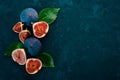 Fig. Fresh fruit figs on a stone black table. Royalty Free Stock Photo