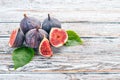 Fig. Fresh fruits of figs on a white wooden table. Royalty Free Stock Photo