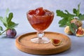 Fig jam in a glass bowl. Fruits preserve
