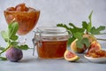 Fig jam in a glass jar and bowl. Fruits preserve