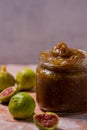 Fig Jam in Jar Surrounded by Fresh Figs