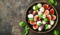 Fig and mozzarella salad in bowl on rustic background Royalty Free Stock Photo
