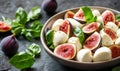 Fig and mozzarella salad in bowl on rustic background Royalty Free Stock Photo