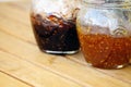 Fig and orange jam jar on wooden background Royalty Free Stock Photo