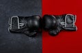 The fight begins. High angle shot of a pair of boxing gloves placed together on top of a multi coloured background Royalty Free Stock Photo