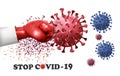 Fight coronavirus concept. Hand wearing a red boxing glove fighting with COVID -19 virus