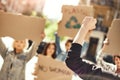 Fight like a girl Back view of female activist protesting for ecology with group of demonstrators holding signboards