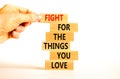 Fight for love symbol. Concept words Fight for the things you love on wooden blocks on a beautiful white table white background.