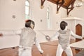 Fight, sport and people with fencing sword in training, exercise or workout in a hall. Martial arts, foil and fencer men