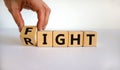 Fight for your right. Male hand turns cubes and changes the word `right` to `fight` on a beautiful white background. Business