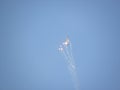 Fighter aircraft shooting fireballs during an aerial exhibition