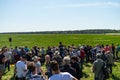 Fighter, attack and reconnaissance aircraft Saab JAS 39 Gripen on the runway and visitors.