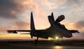 Fighter jet on air force base airfield getting ready to take off at sunset Royalty Free Stock Photo