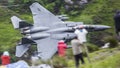 Fighter Jet flying low between valley and people Mach Loop UK Royalty Free Stock Photo