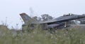 Fighter Jet Landing in Rain Creates Spectacular Water Splashes