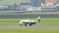 A fighter jet sitting on top of a runway