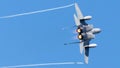 Fighter jet soaring through a bright blue sky.