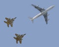 Fighter jets escorting passenger airplane Royalty Free Stock Photo