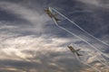 Fighter jets in formation flying past clouds Royalty Free Stock Photo