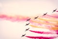 Fighter jets of the Spanish Air Forces Eagle Patrol drawing a wake with the colors of the Spanish flag with aerial acrobatics Royalty Free Stock Photo