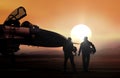 Fighter pilot on military airbase during sunset Royalty Free Stock Photo