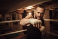Fighter shadowboxing on training ring Royalty Free Stock Photo