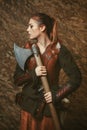 Fighter woman poses with battle axe Royalty Free Stock Photo