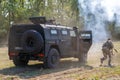 Fighters of the Russian special forces are getting out from an armored car called Tiger