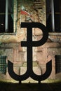 Fighting Poland, the symbol of the anchor at night against the background of the illuminated wall