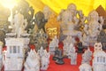 Figra is a golden buddha and figures of other gods, Ganesha. India Royalty Free Stock Photo