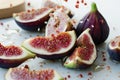 figs being quartered, seeds scattering with juice Royalty Free Stock Photo