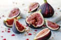 figs being quartered, seeds scattering with juice