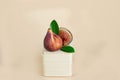 Figs close-up on a pastel background on a wooden cube. Modern kitchen trends. The concept of proper nutrition,vegetarian diet