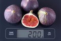 Figs on kitchen scale Royalty Free Stock Photo