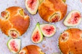 Figs muffins with fresh fruits on baking paper and wooden background Royalty Free Stock Photo