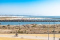 Figueira da Foz PORTUGAL - 13 August 2021 - Bike path with cyclist, next to the beach with several people practicing sports