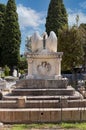 Figure of angel on his back in the cemetery of Sitges